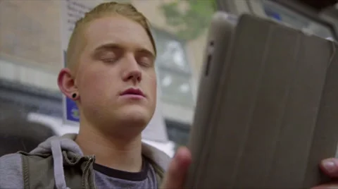 Close up of guy swiping on tablet computer Stock Footage 54098720