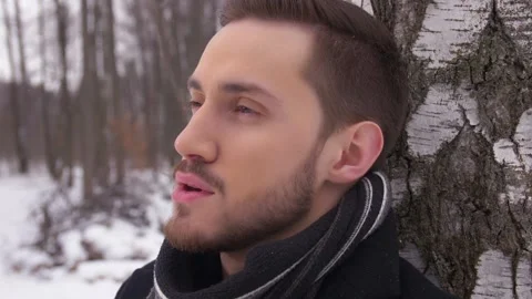  Close-up of a Guy who Thoughtfully Looks at the Camera Stock Footage 163466682