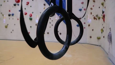 Close-up of gymnastic rings hanging from the ceiling. Stock Footage 149666691