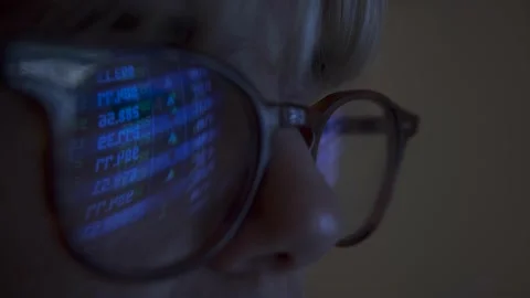 Close up of Hacker in front of his computer screen reflecting in glasses coding  Video stock 157306094