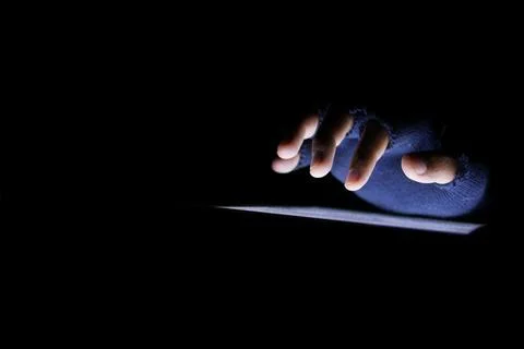 Close up of hacker hand stealing data from digital tablet Stock Photos