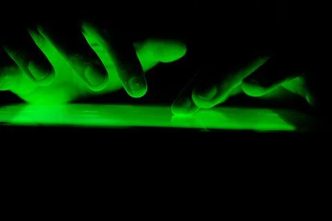 Close up of hacker hand stealing data from digital tablet Stock Photos