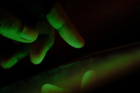 Close up of hacker hand steeling data Stock Photos