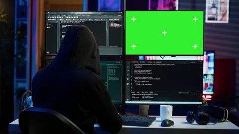 Close up of hacker running code in apartment on PC monitors Stock Footage 275762302