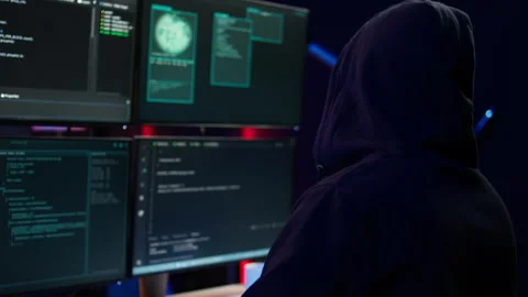 Close up of hacker running code in apartment on PC monitors Stock Footage 275861982
