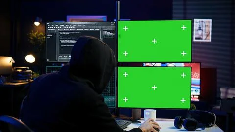 Close up of hacker running code in apartment on PC monitors Stock Photos