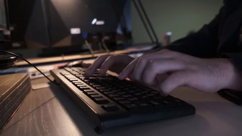 Close-up of hacker typing on keyboard. Stock footage. Programmer quickly typing Stock Footage 114887171