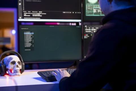 Close up of hacker typing on keyboard, targeting unpatched connections Stock Photos