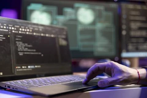 Close up of hacker using laptop, coding malware Foto stock