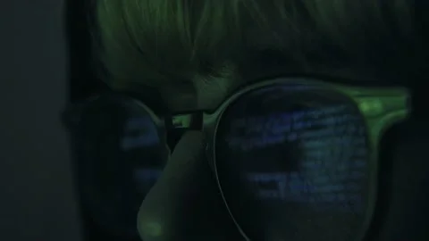 Close up of hacker working on a computer screen. Code is reflected in eye 스톡 동영상 151074550