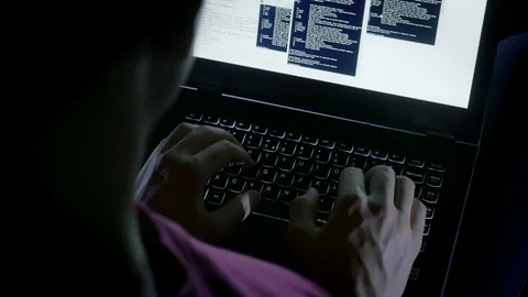 Close-up of hacker's hands typing codes on the keyboard Stock Footage 72544156