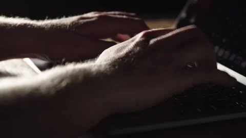 A  close up of hacker's hands typing on Mac Laptop Video stock 248112889