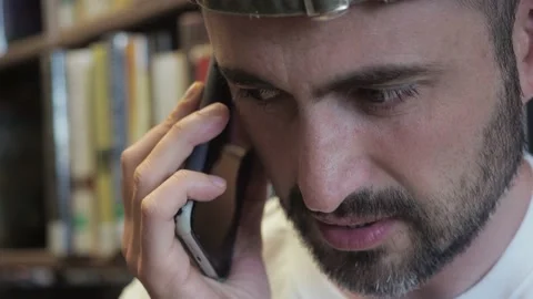 Close up. Hadsome middle aged bearded man in white T-shirt talking serious Stock Footage 153767611