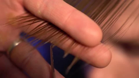 Close-up of haircut master cutting with scissors Stock Footage 132894203