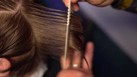 Close-up of haircut master cutting with scissors Stock-Footage 135251017