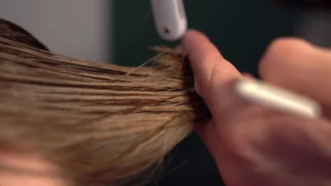 Close-up of haircut master cutting with scissors Stock Footage 135735494