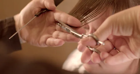 Close-Up Haircut: Sharp Scissors Trim Hair Strands. 動画素材 262762400