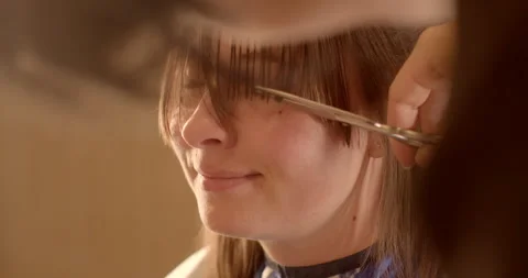 Close-Up Haircut: Sharp Scissors Trim Hair Strands stylist working with client. 動画素材 262764243
