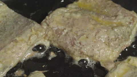 Close-up of hake fish pieces frying in a pan Stock-Footage 314809148