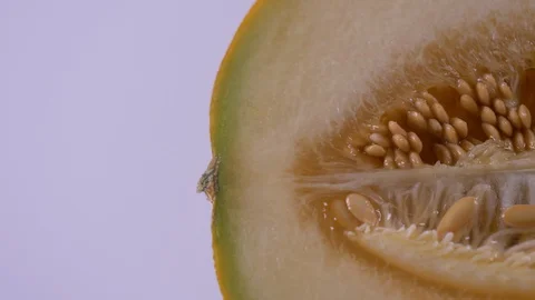 Close Up of Half an Cantaloupe Melon Panning to the right. Cantaloupe 스톡 동영상 128273247