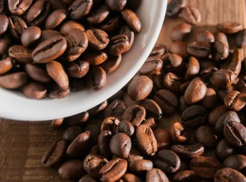 Close-up of half a cup of coffee beans Stock Photos