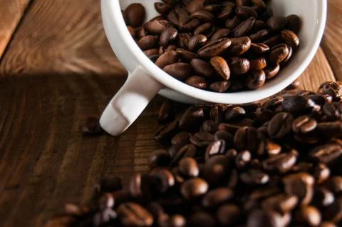 Close-up of half a cup of coffee beans Stock Photos