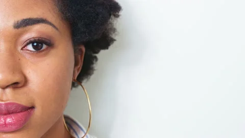 Close-up of half face of African American young woman. Black beautiful girl look Stock Footage 155804742