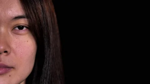 Close up half face portrait of Asian female face Stock Footage 231508870