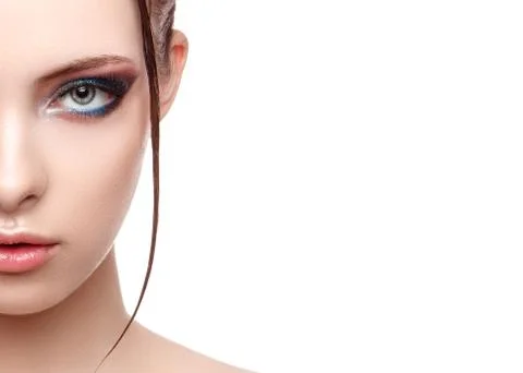Close up half face portrait of model with glamorous makeup, wet effect on her Stock Photos