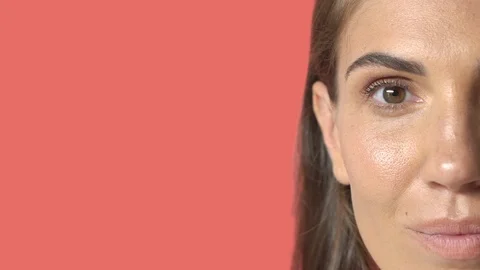 Close-up half face pretty brunette caucasian woman with braces look camera then Stock Footage 115647085