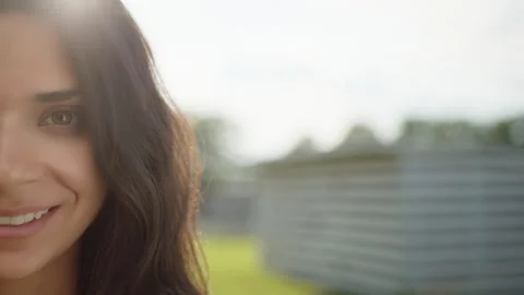 Close up of half face of pretty brunette with swarthy skin. Blurred background Stock Footage 244379613