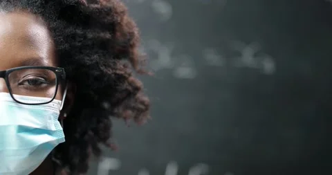 Close up of half face of young African American female teacher in glasses and Stock Footage 138445296
