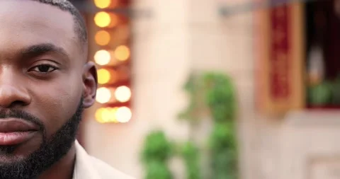 Close up of half face of young African American handsome man with beard looking Stock Footage 148244198