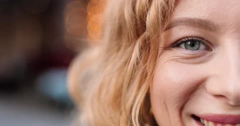 Close up of half face of young Caucasian beautiful woman with fair hair looking Stock Footage 148244394