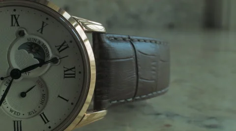 Close up of a half faced Wrist Watch with second hand against light background 库存影片 68191151