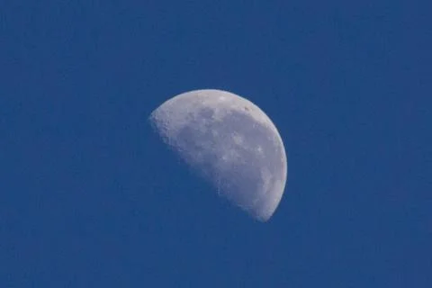 Close up of the half-moon at blue sky Stock Photos