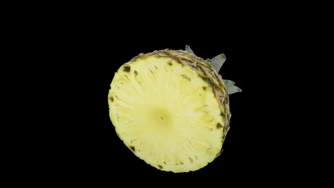 Close up of half pineapple rotating seamless loop Alpha Channel Video stock 114801232