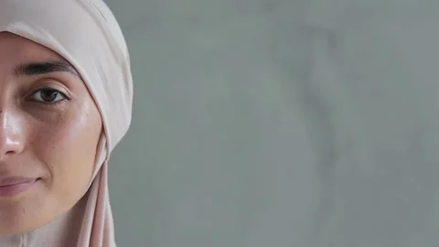 Close up of half portrait of beautiful Arab woman in Muslim hijab dress, clean Video stock 170678614