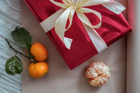 Close-Up of Half Red Gift Box with Tangerines Stock Photos