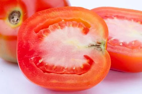 Close up half tomato Stock Photos