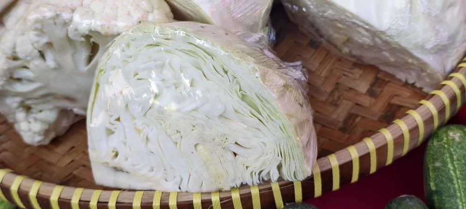 Close‑up of a halved cabbage wrapped in plastic Foto stock