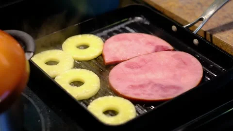 Close Up of Ham and Pineapple Slices Cooking on Grill Pan Stock Footage 332178942