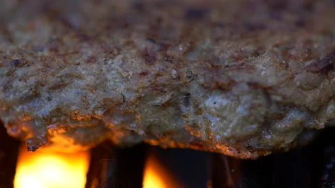Close Up of Hamburger On A Grill With Flames Stock Footage 130219108