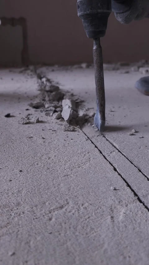 Close-up of a hammer drill in action breaking through concrete with precision Stock Footage 285131653