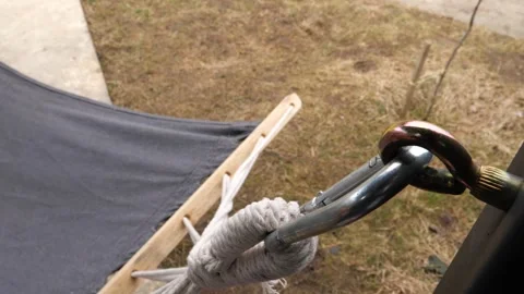 Close-up of hammock attached to carabiner hanger Stockbeeldmateriaal 270495391