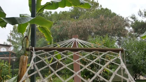 Close up of a hammock on a sunny day on a backyard Video stock 76614837