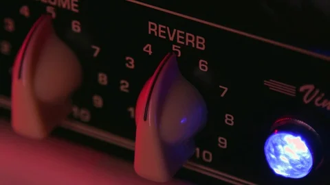 Close up of Hand adjust Reverb on max of Guitar Amplifier Stock Footage 124086053