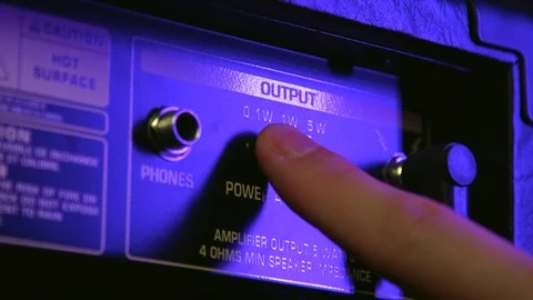 Close up of Hand Adjusting Amplifier Output Power Stock Footage 124086665