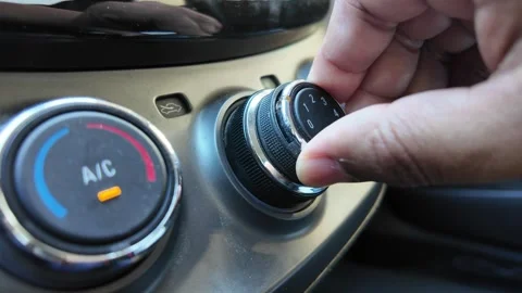 Close Up of Hand Adjusting Car Air Conditioning Control Knob Stock Footage 343577586