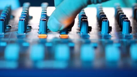 Close up of hand adjusting switch on mixing desk Stock Footage 174691117